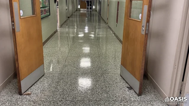 Polished school corridor floor after janitorial service by Oasis Cleaning